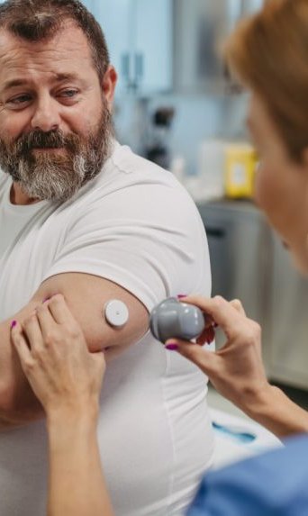 A patient smiling at his doctor