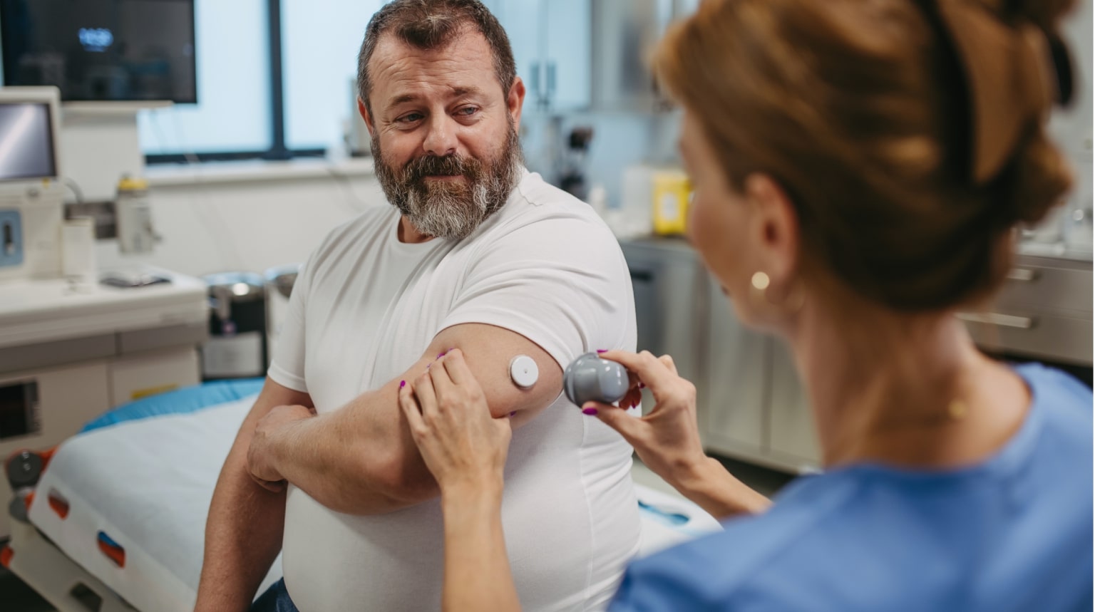 A patient smiling at his doctor