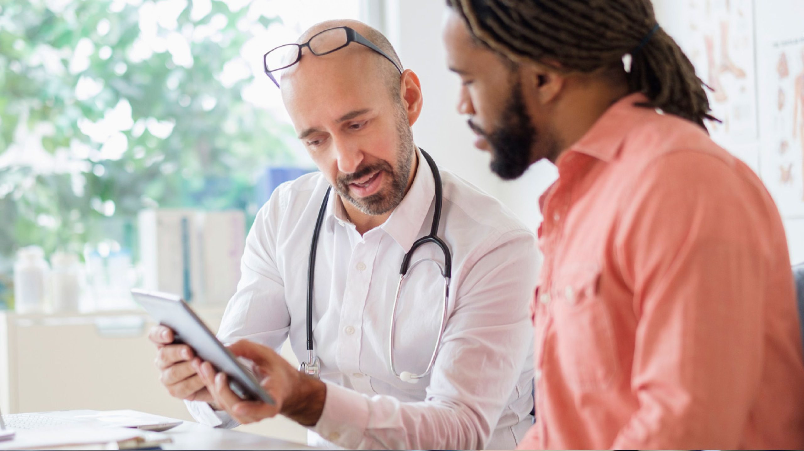 A patient and doctor looking at test results